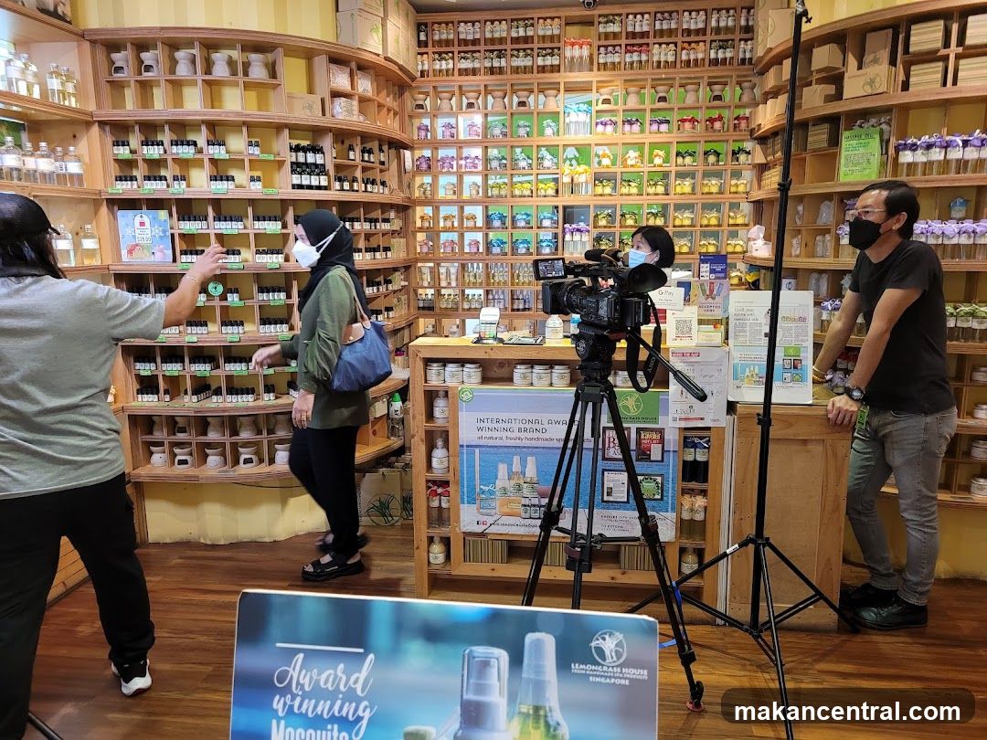 Interior of a retail store with filming setup