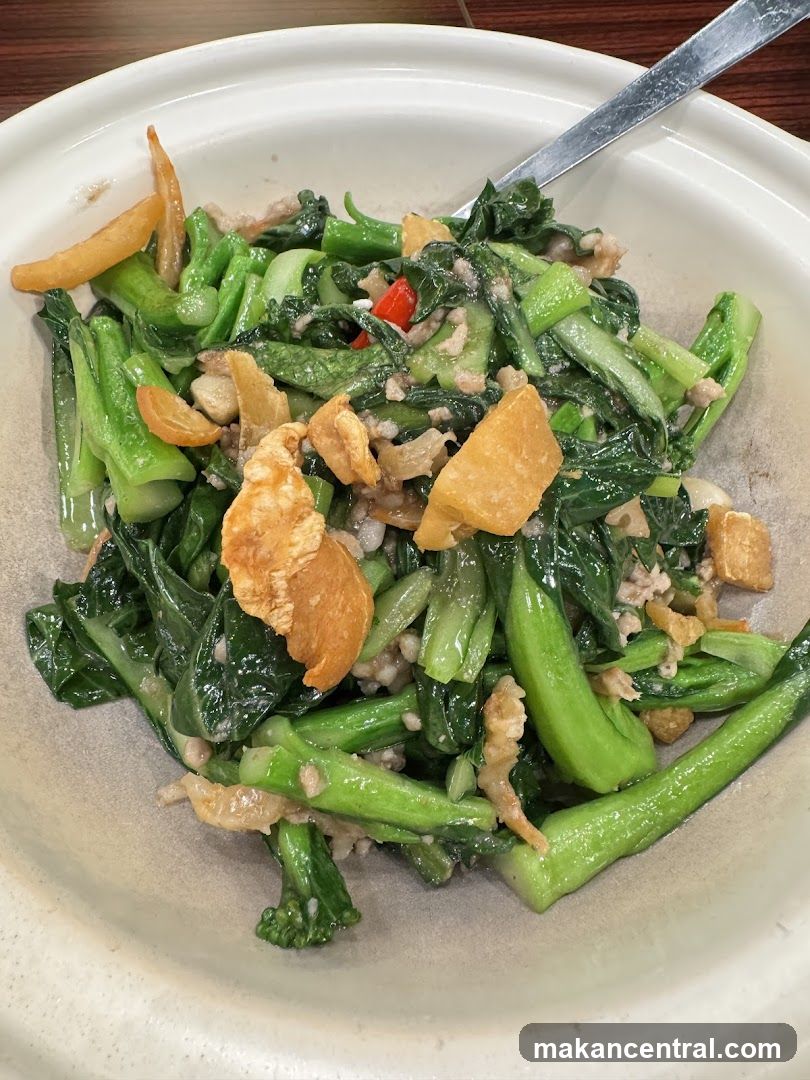 Stir-fried greens with crispy toppings
