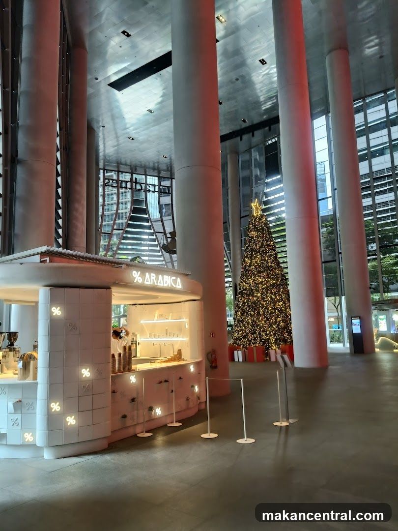 Interior of a modern atrium with café and Christmas tree
