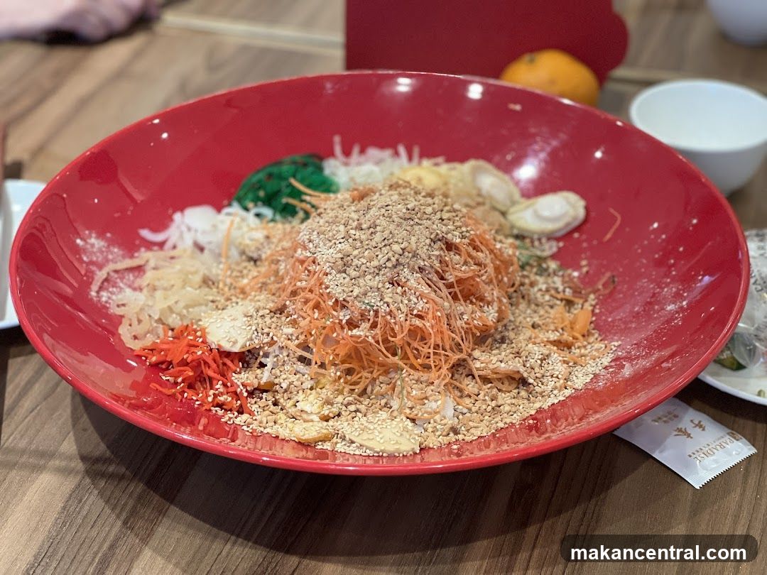Red bowl of noodles with toppings