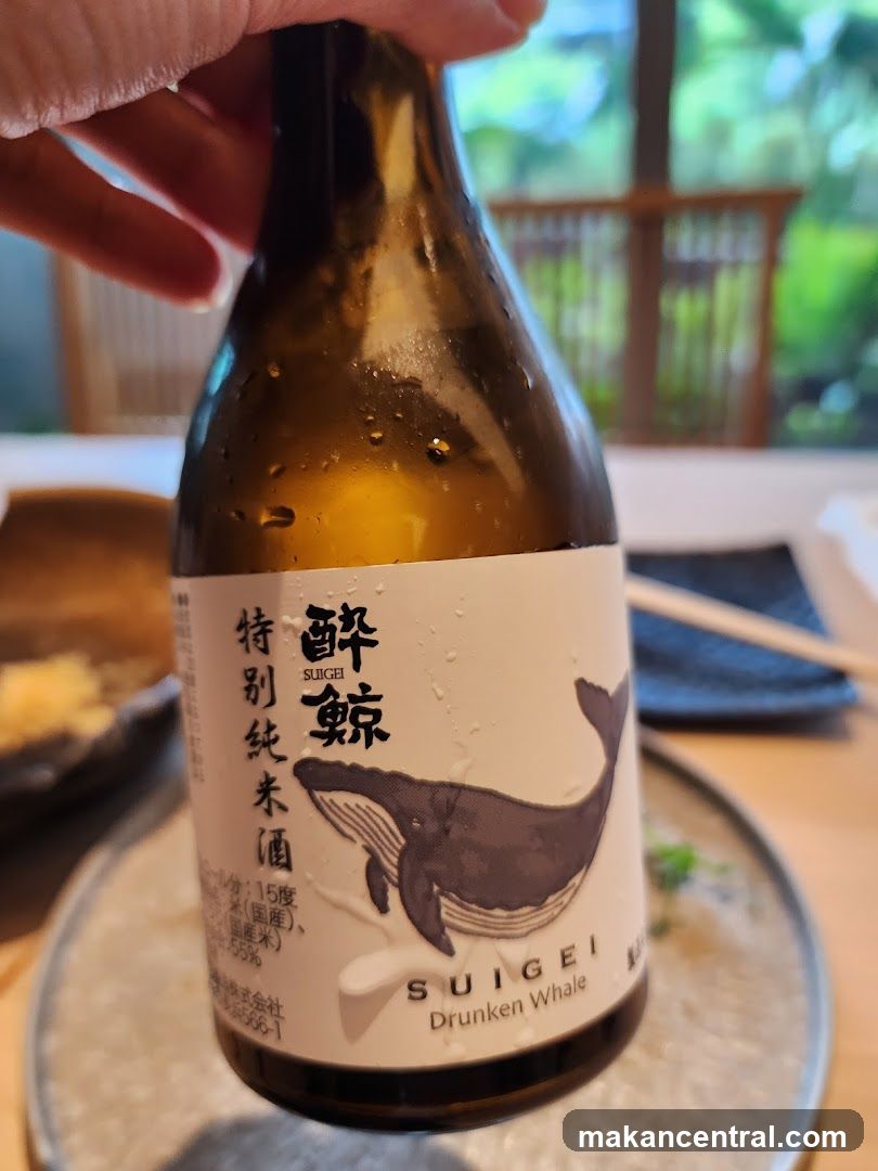 Sake Bottle Held in Hand