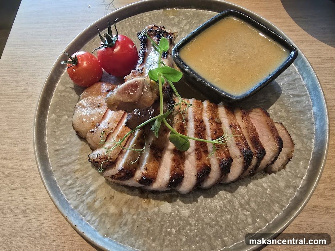 Grilled Meat Dish with Sauce and Tomatoes