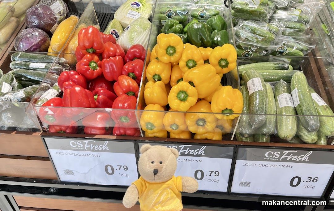 Vegetable Display with Stuffed Bear
