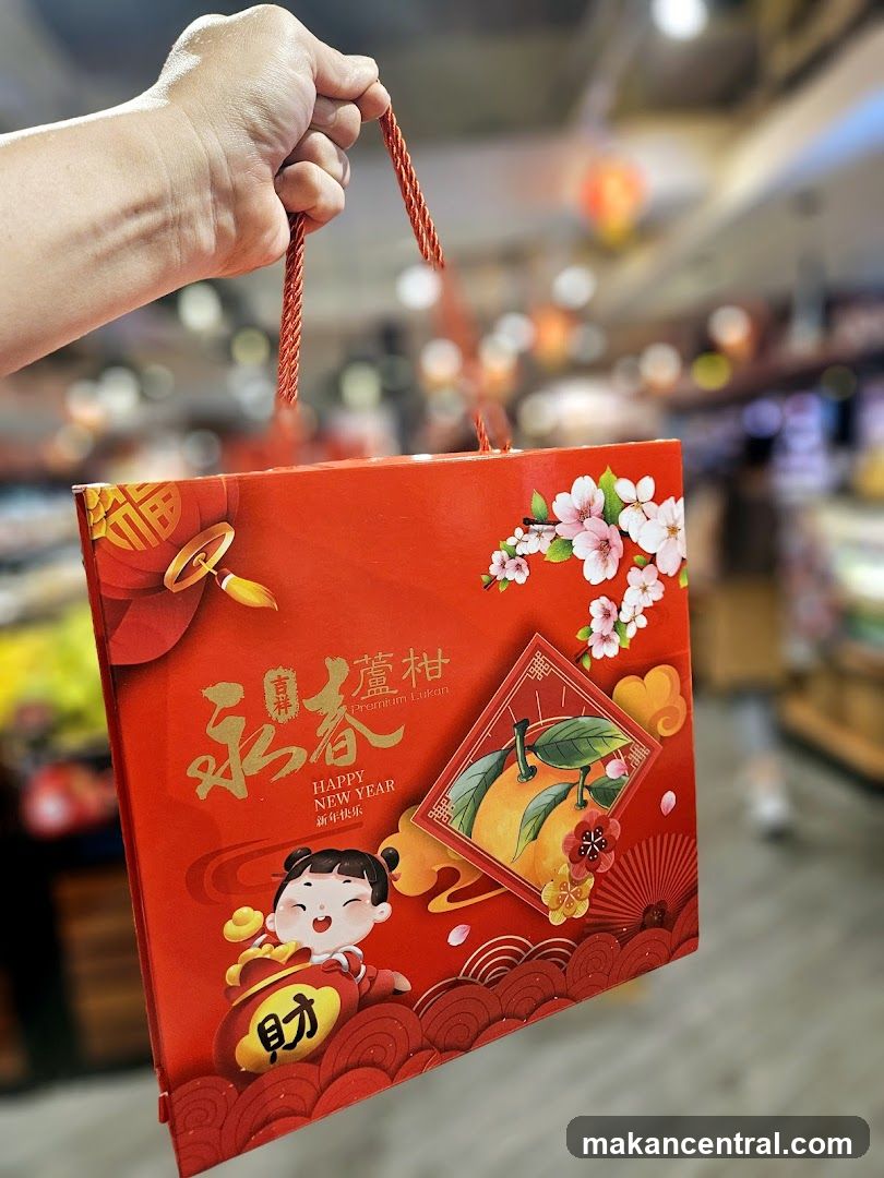 Hand holding New Year gift box
