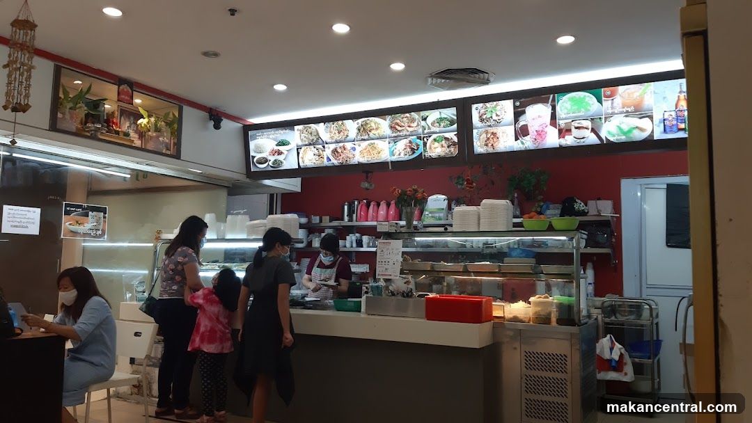 Restaurant interior with customers and staff
