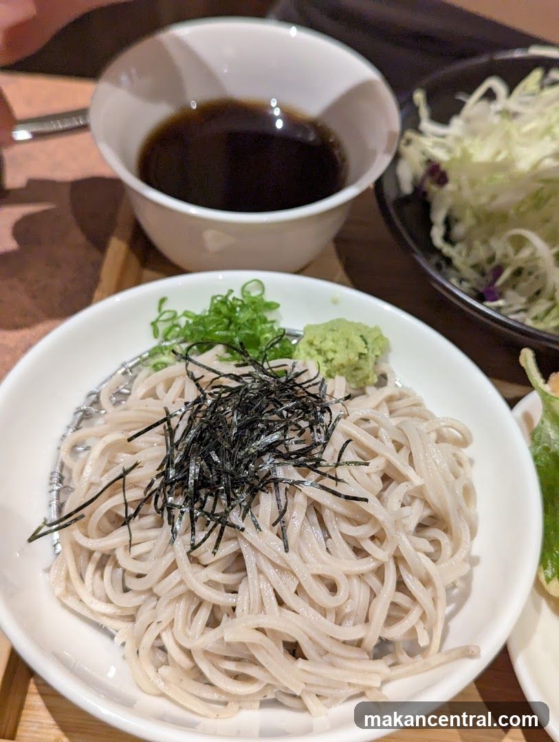 Noodles with garnishes and dipping sauce
