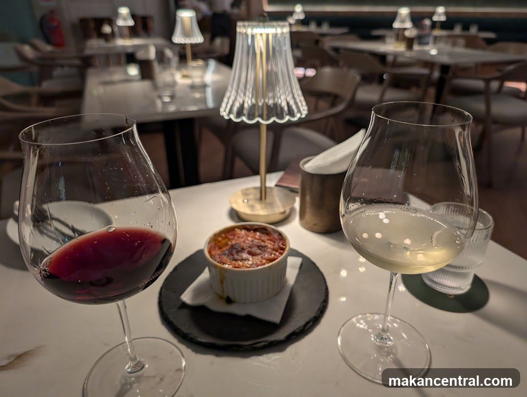 Table setting with wine and food