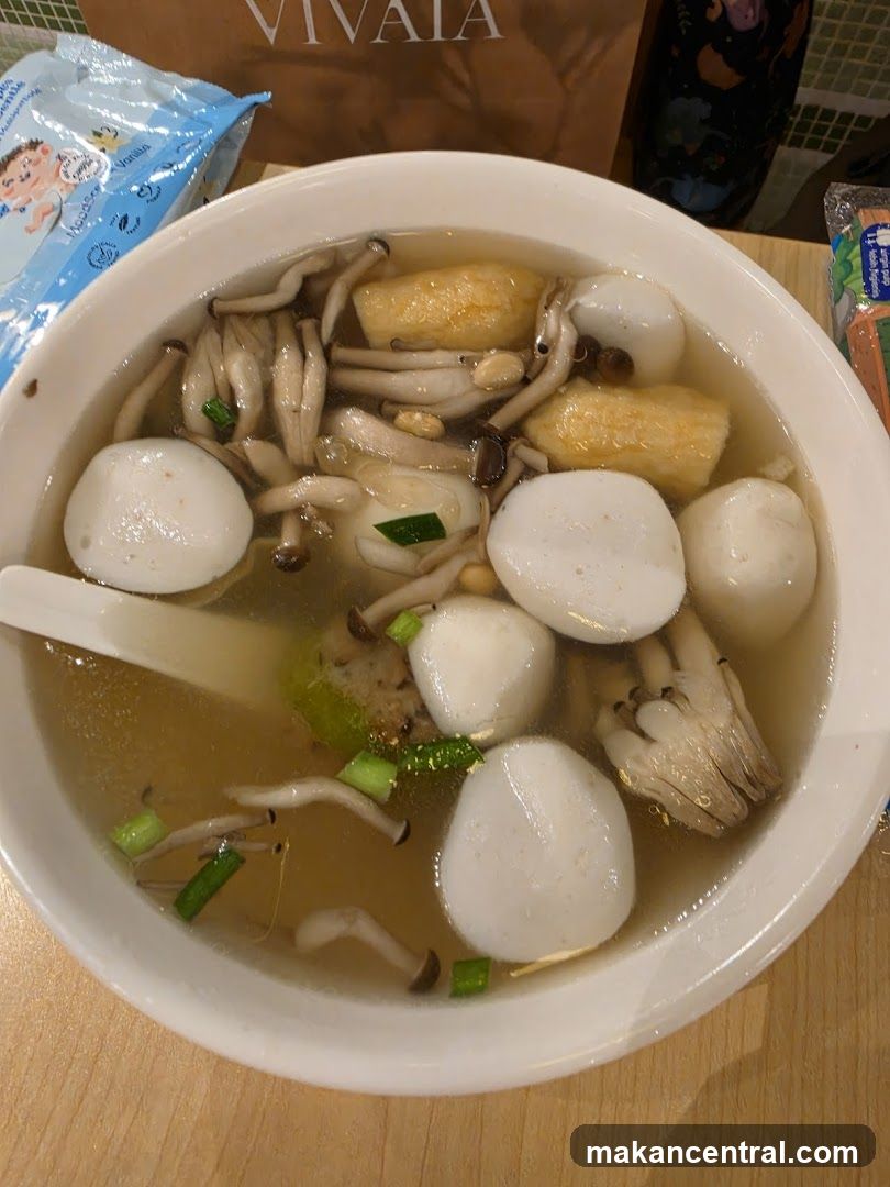 Bowl of Soup with Fish Balls and Mushrooms