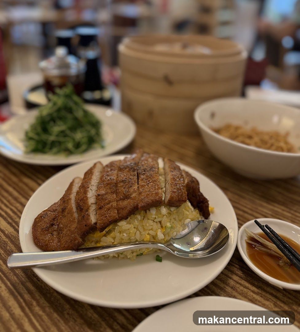 Slices of roasted meat over fried rice