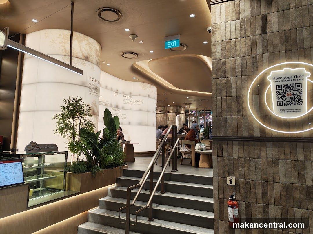 Interior of a cafe with seating and plants