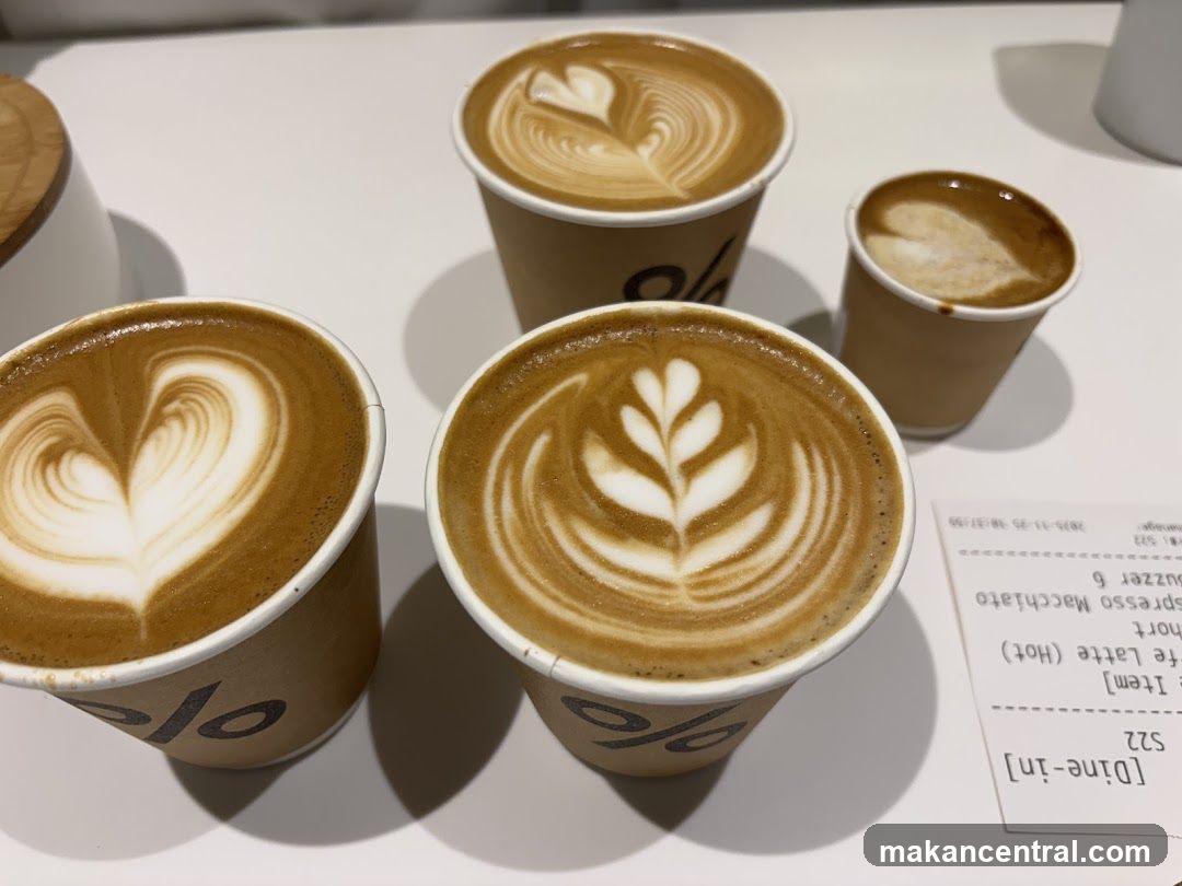 Four coffees with latte art