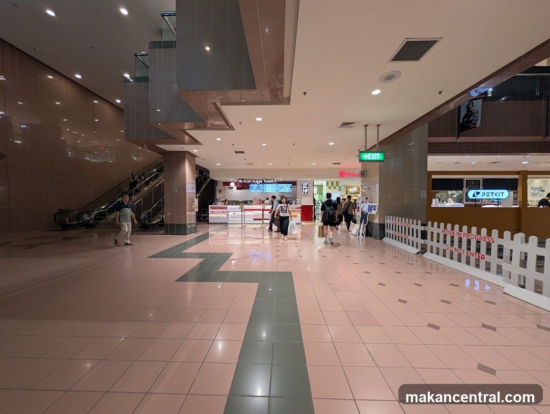 Mall Interior with Shops and Escalators