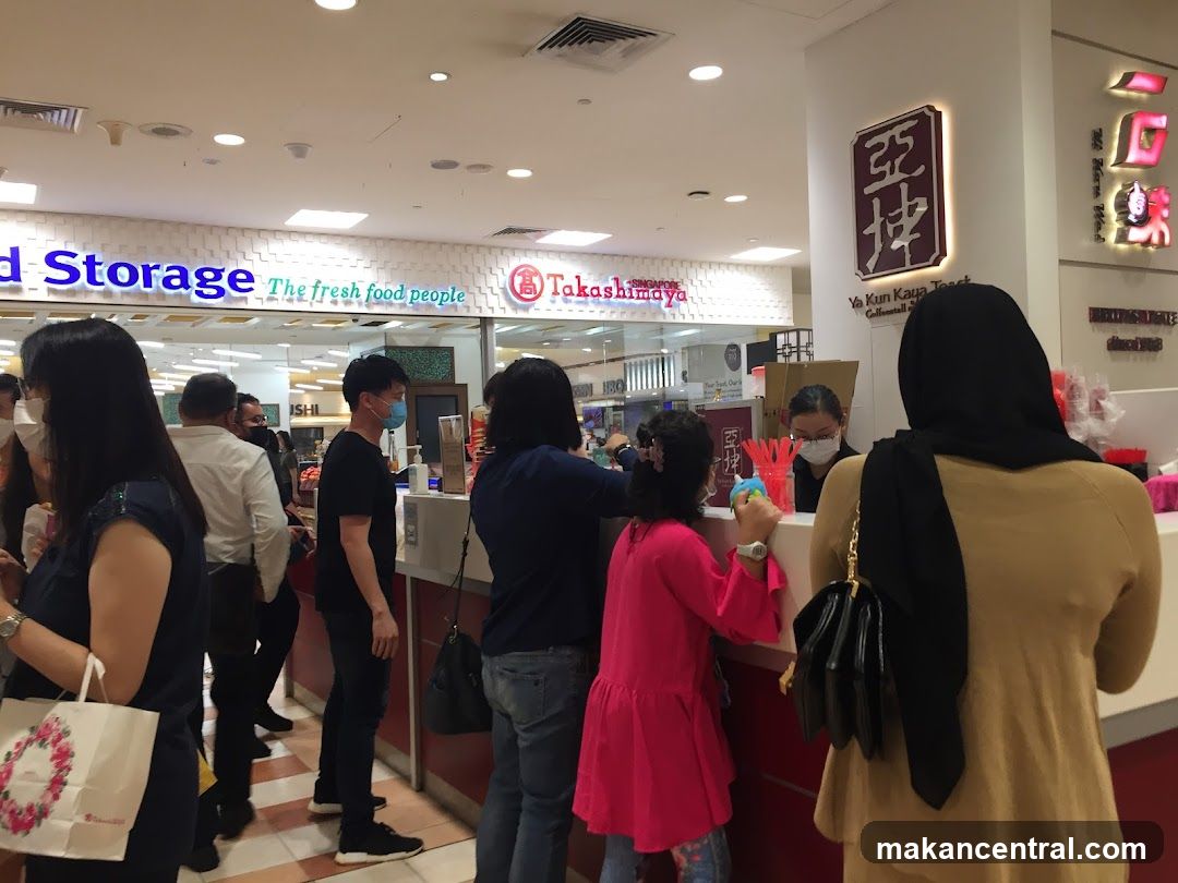 People queuing at a food stall