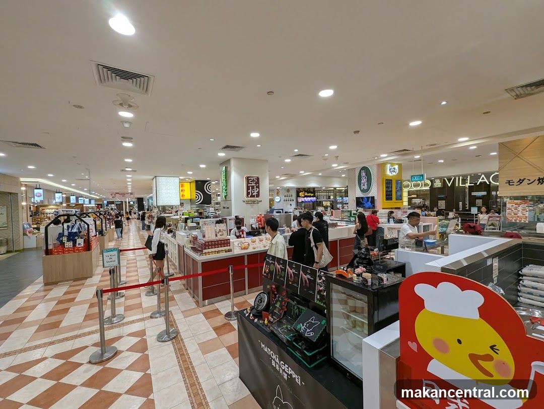 Food court with various stalls and shoppers