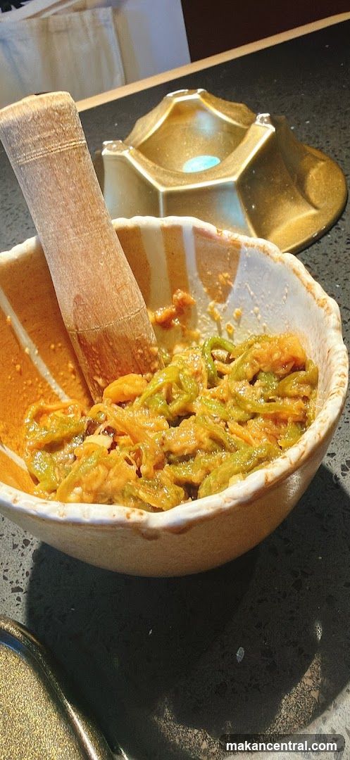 Food in a bowl with a wooden utensil
