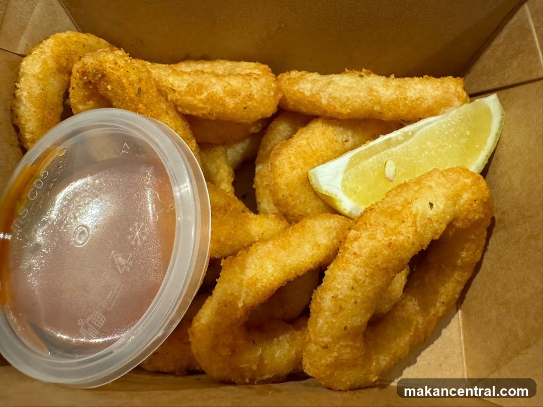 Calamari Rings with Dipping Sauce and Lemon Wedge