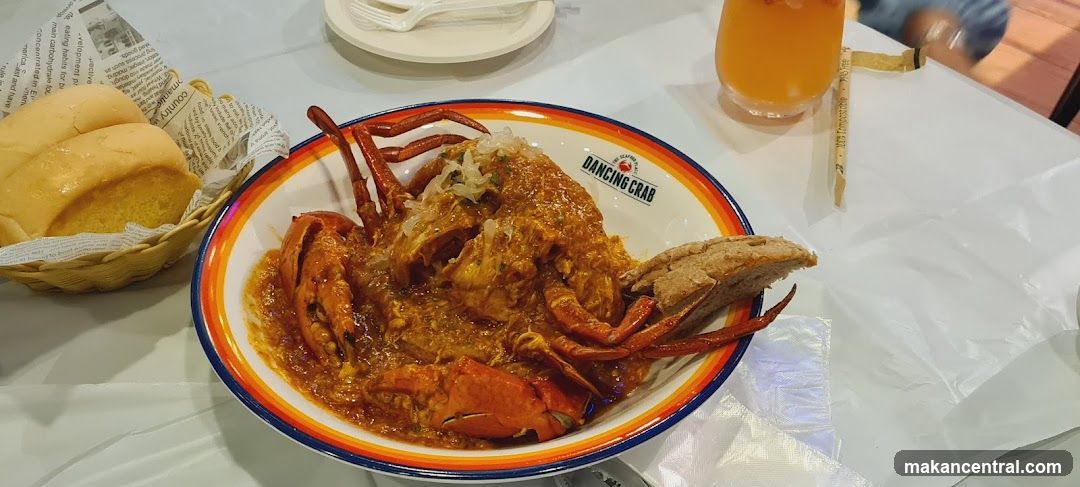 Lobster dish with bread and drink