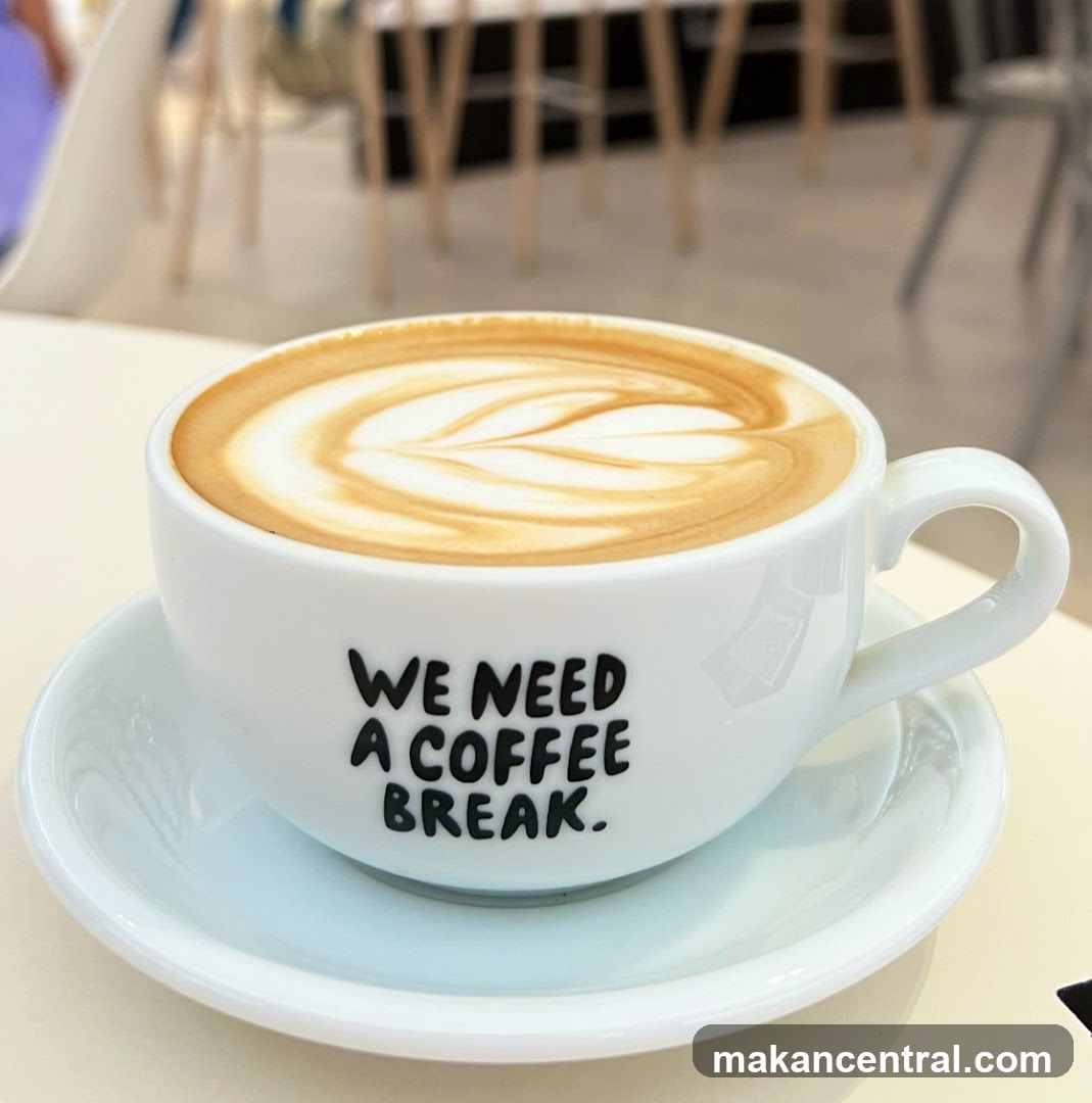 Latte with "We Need A Coffee Break" message