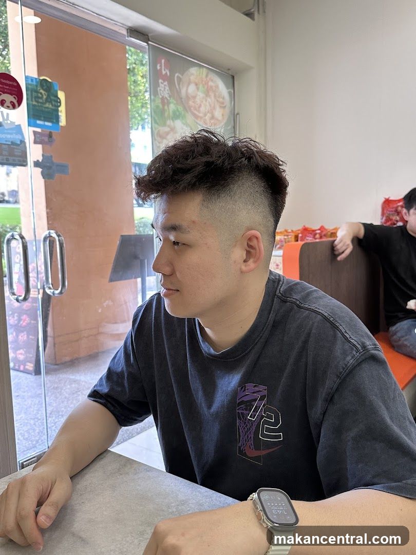 Man Sitting at Table