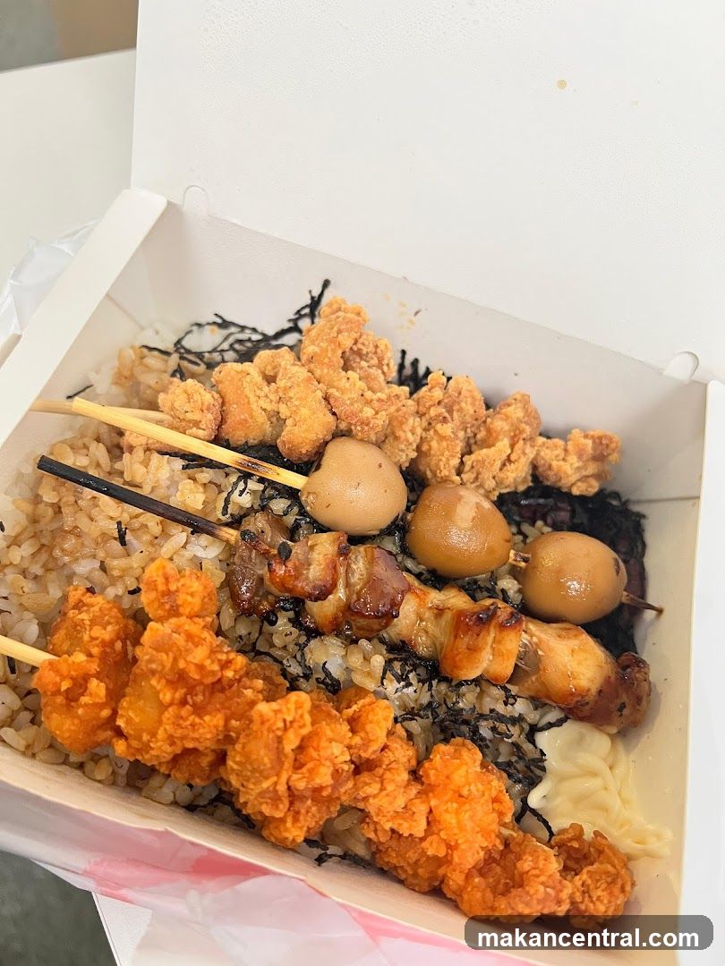 Bento Box with Fried Chicken and Skewers
