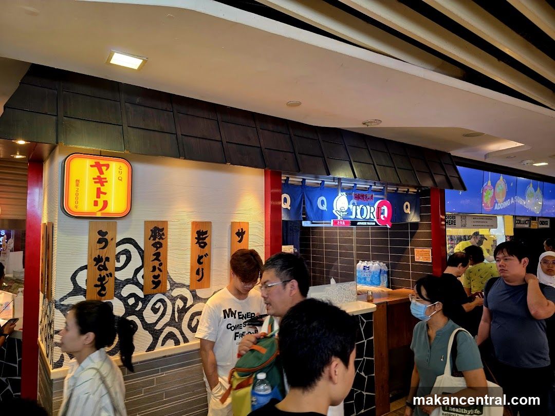 People queuing at a Japanese food stall