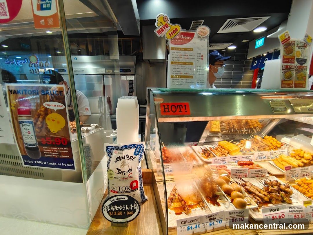 Food display with skewers and sauces