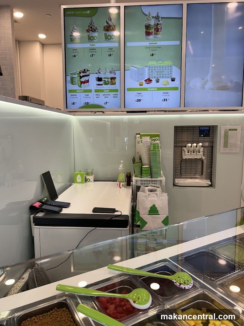 Dessert shop counter with menu and toppings