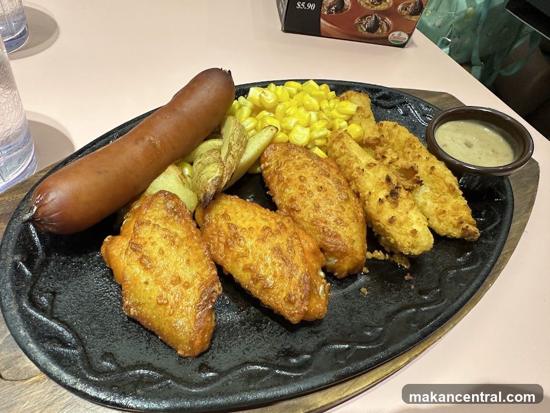 Sizzling Platter with Sausage, Chicken Wings, and Fries