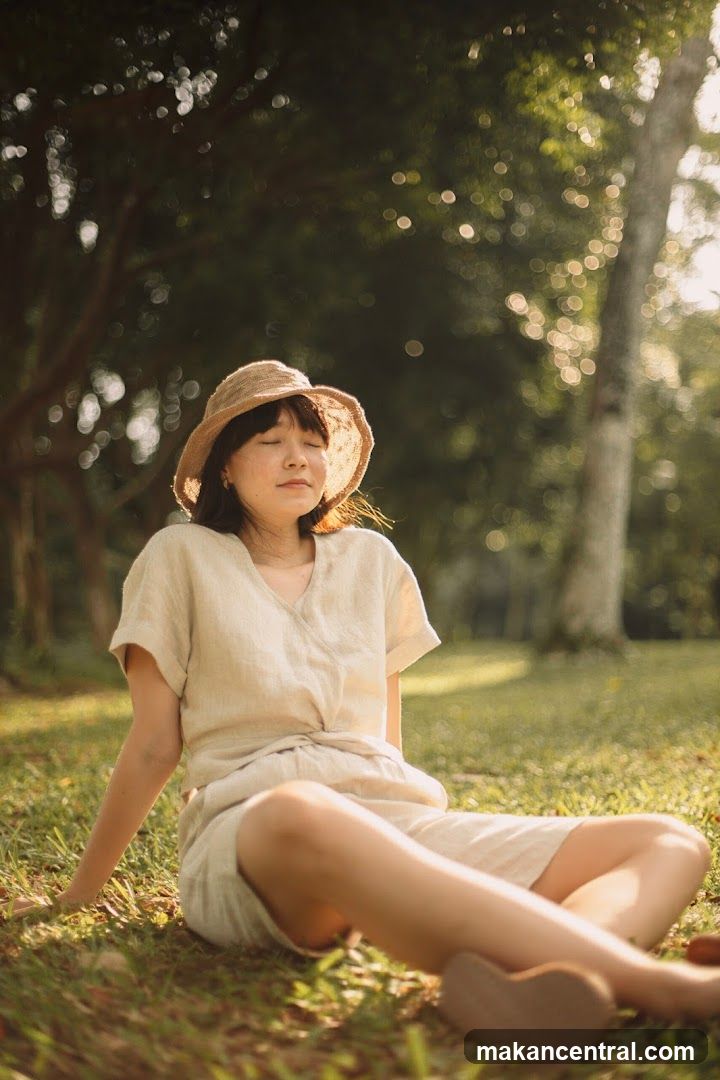 Woman in a hat meditating outdoors