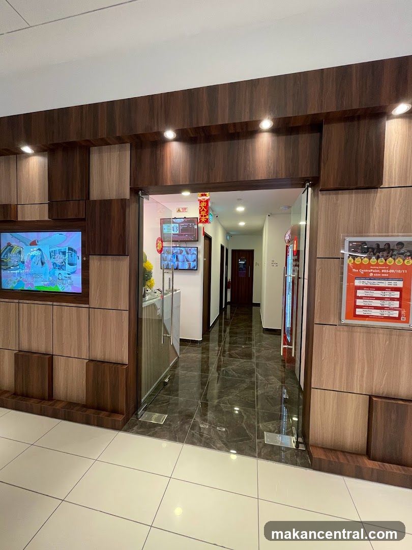 Interior hallway with screens and signage
