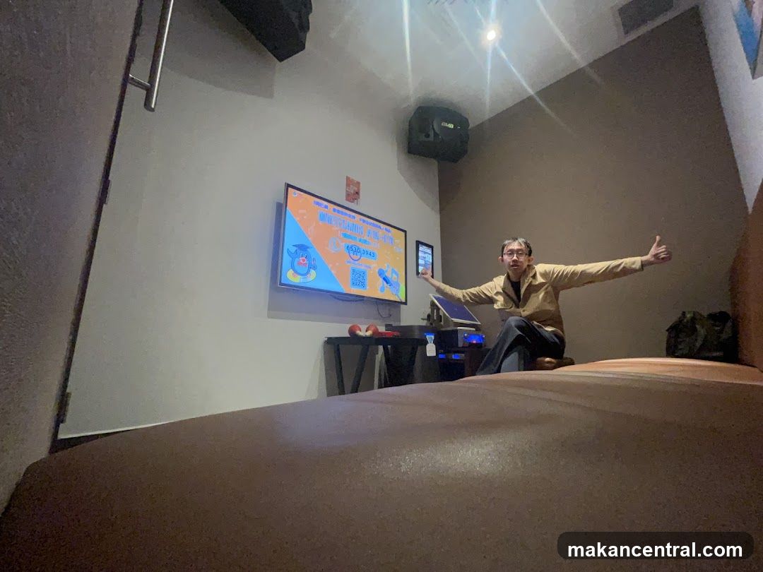 Karaoke Room with Man Giving Thumbs Up