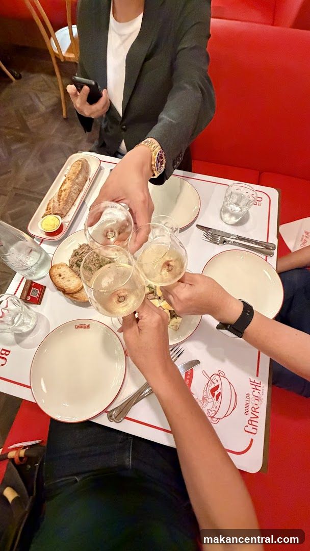 People toasting with wine at a restaurant