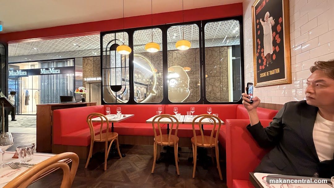 Restaurant Interior with Red Booths and Artwork