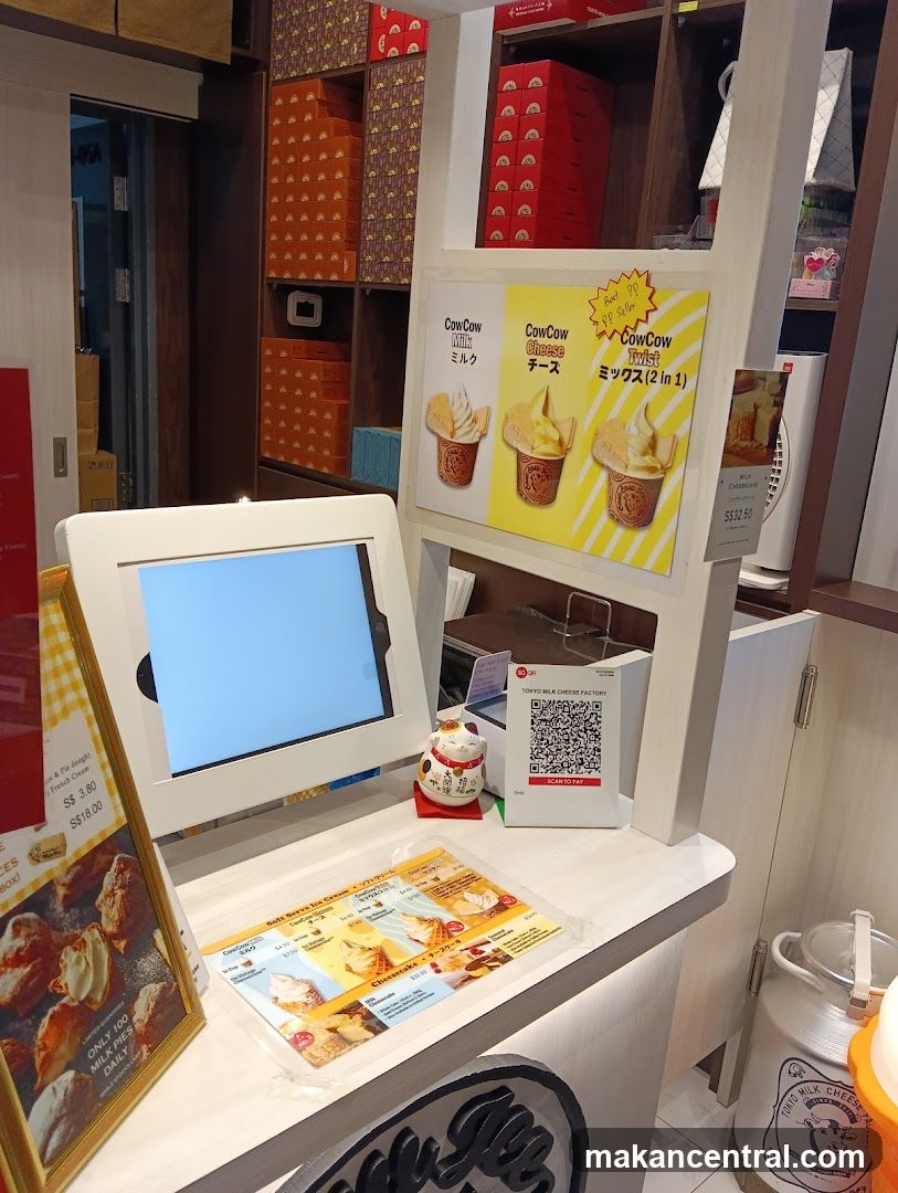 Dessert shop counter with menu and payment options