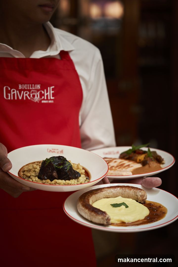 Waiter holding plates of food