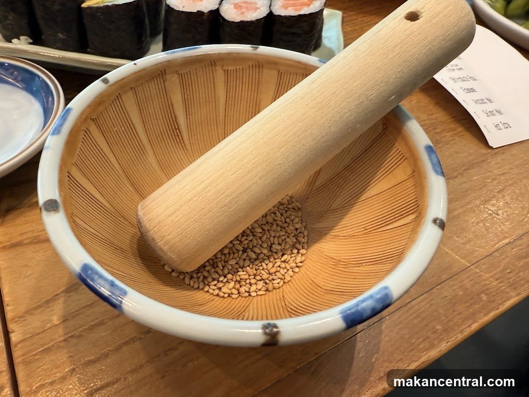 Sesame seeds in a mortar with a pestle