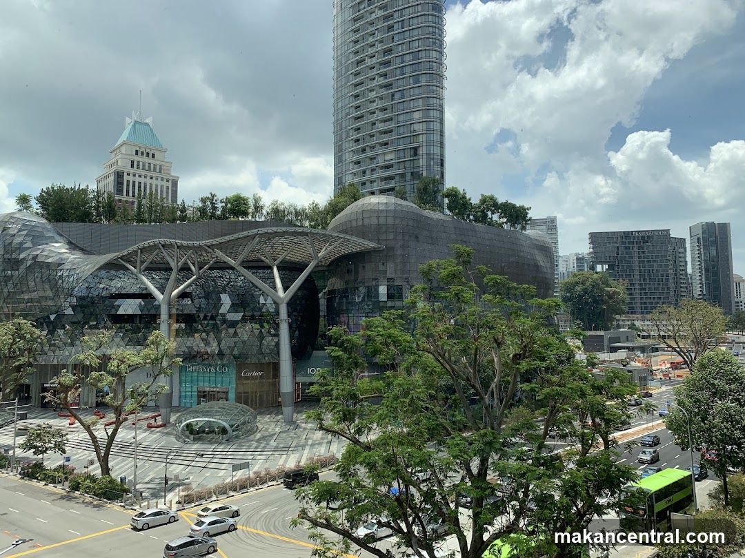 Modern Shopping Complex with City Skyline