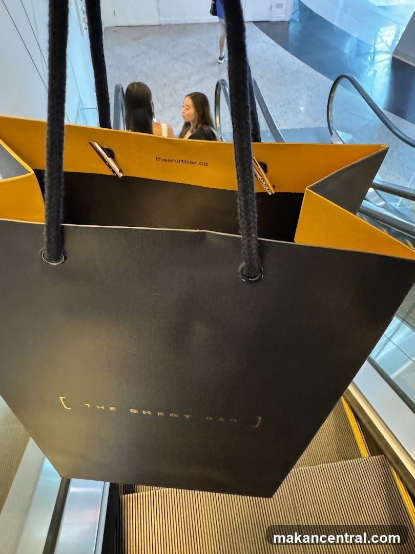 Shopping Bag on Escalator