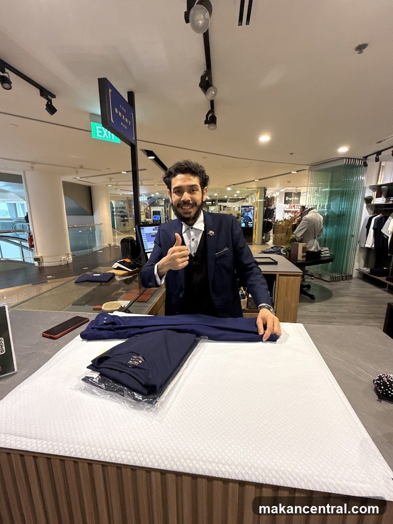 Man folding clothes at a counter