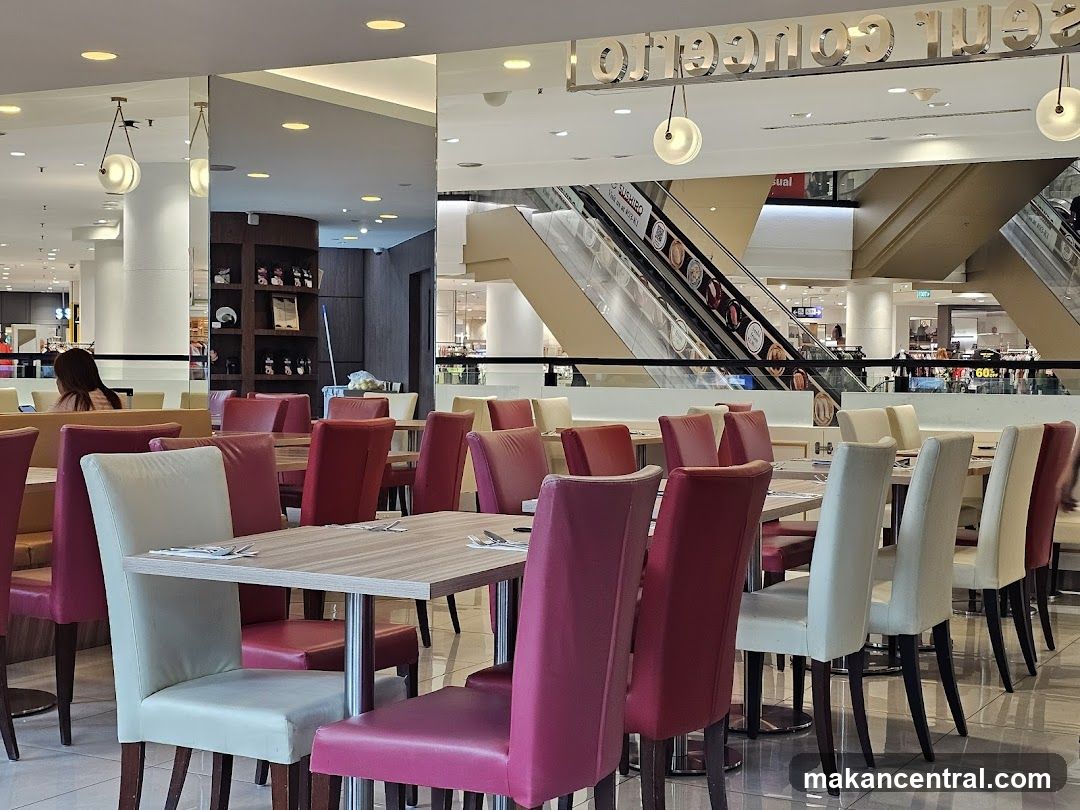 Restaurant Interior with Escalators in Background