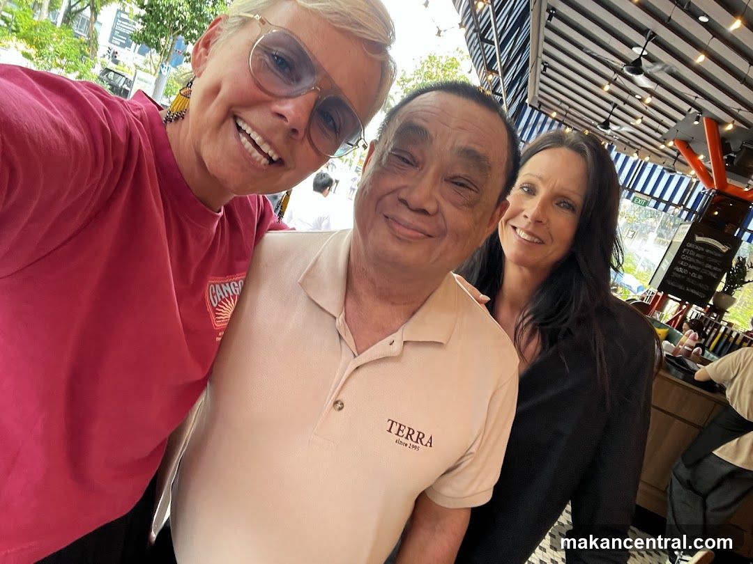 Three people smiling for a selfie