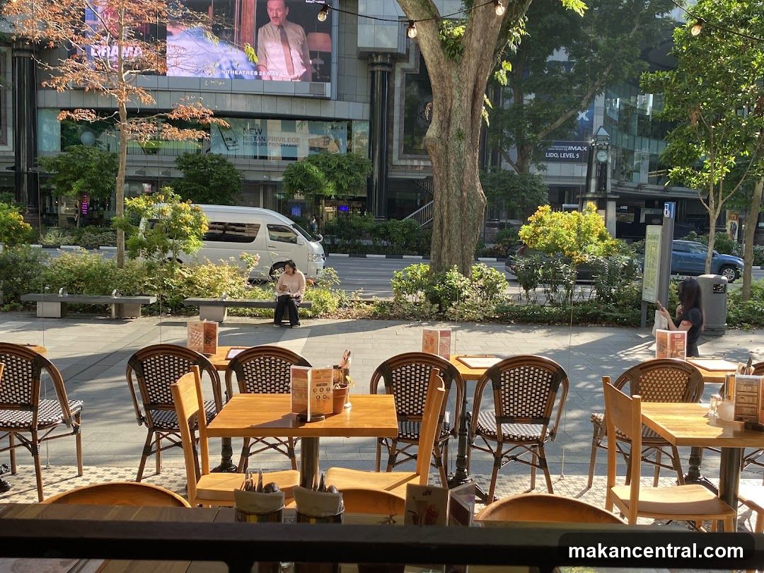 Outdoor cafe seating with street view