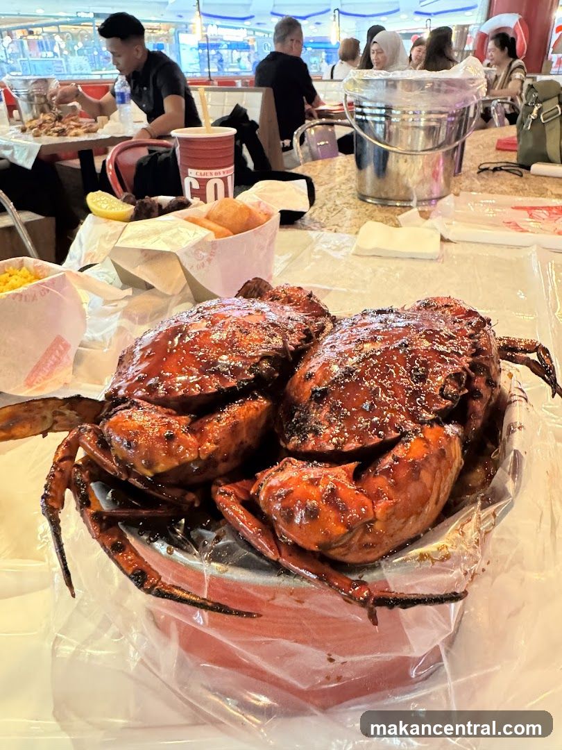 Two crabs covered in sauce