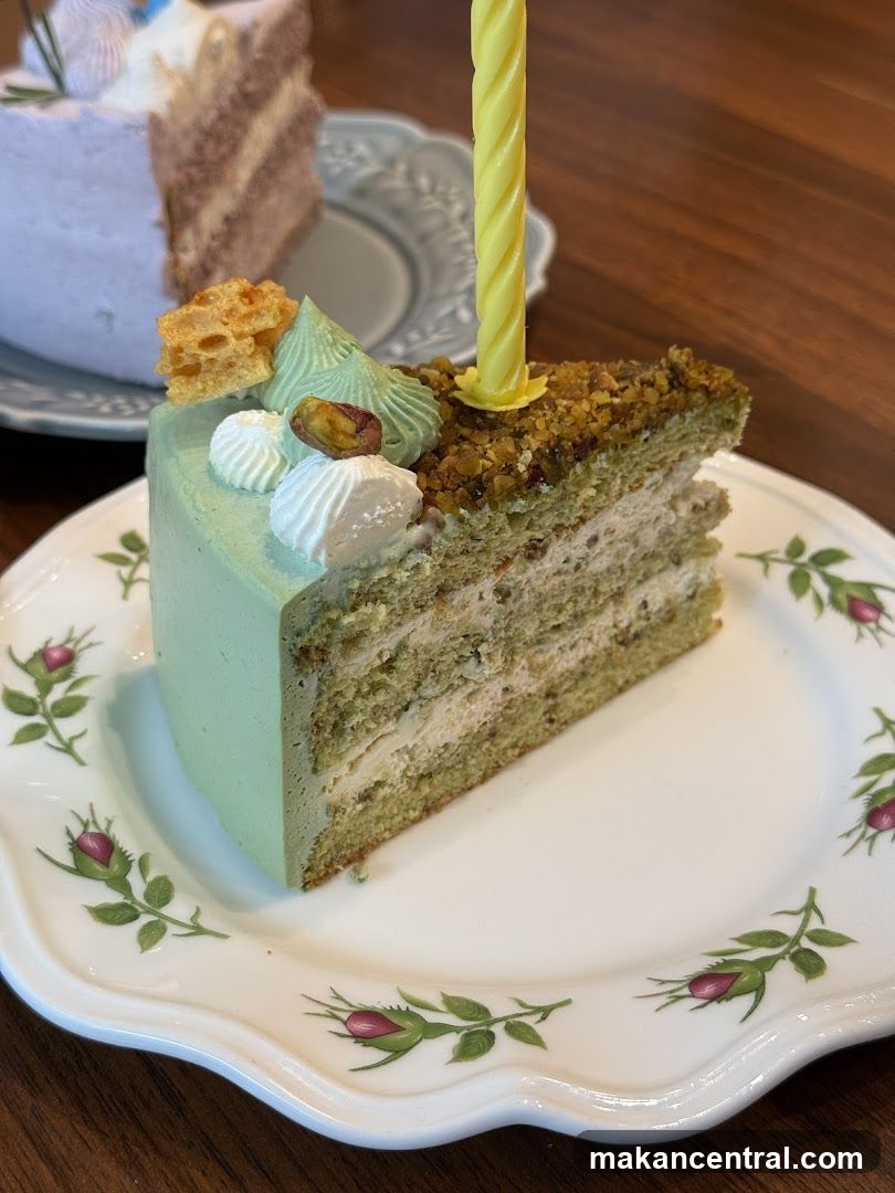 Pistachio Cake Slice with Candle