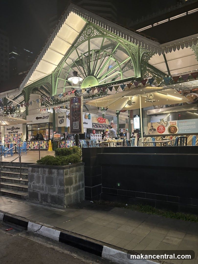 Night view of a food court with outdoor seating