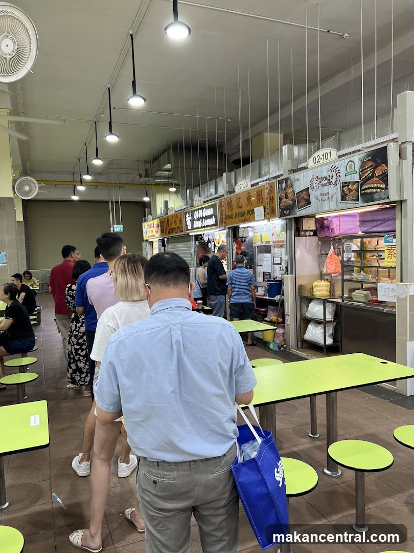 Food stalls with customers queuing
