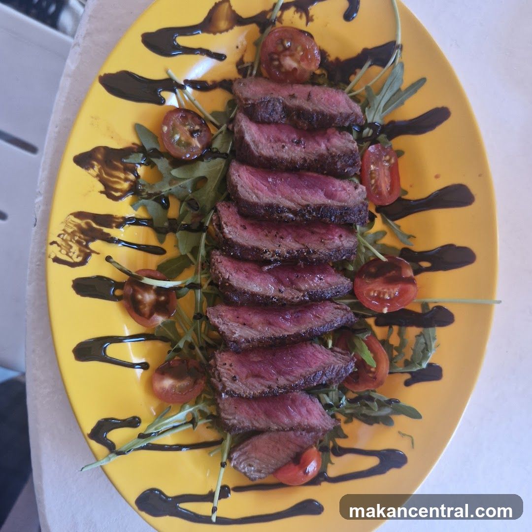 Sliced Steak with Cherry Tomatoes and Arugula