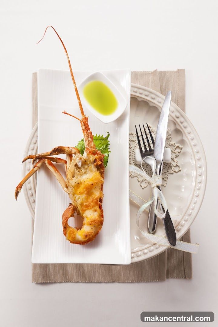 Lobster dish with sauce and cutlery