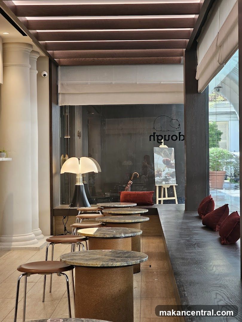 Cafe Interior with Round Tables and Stools
