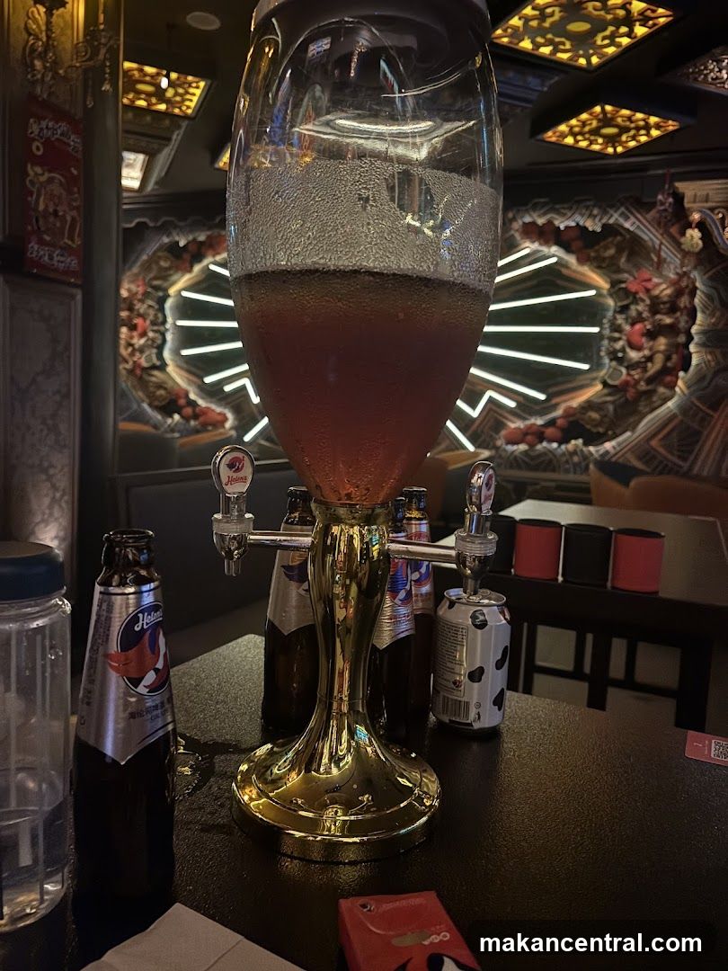 Beer dispenser and bottles on table